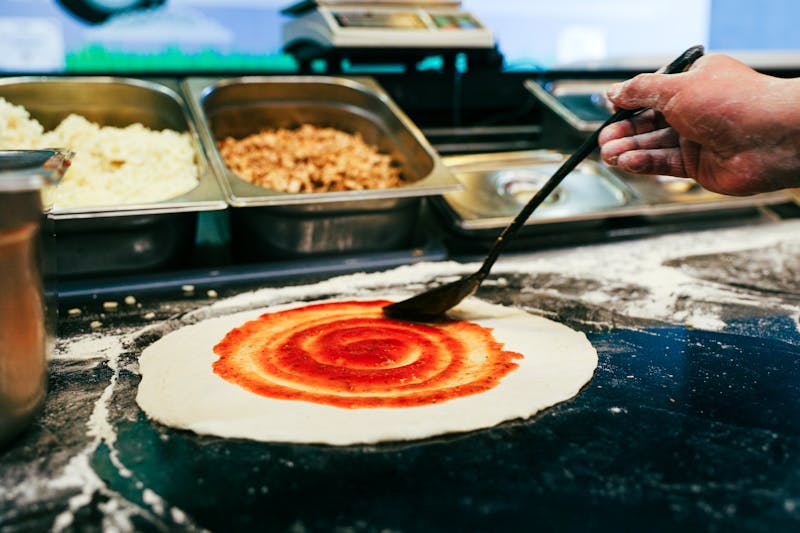 Coal fired pizza being prepared in the oven